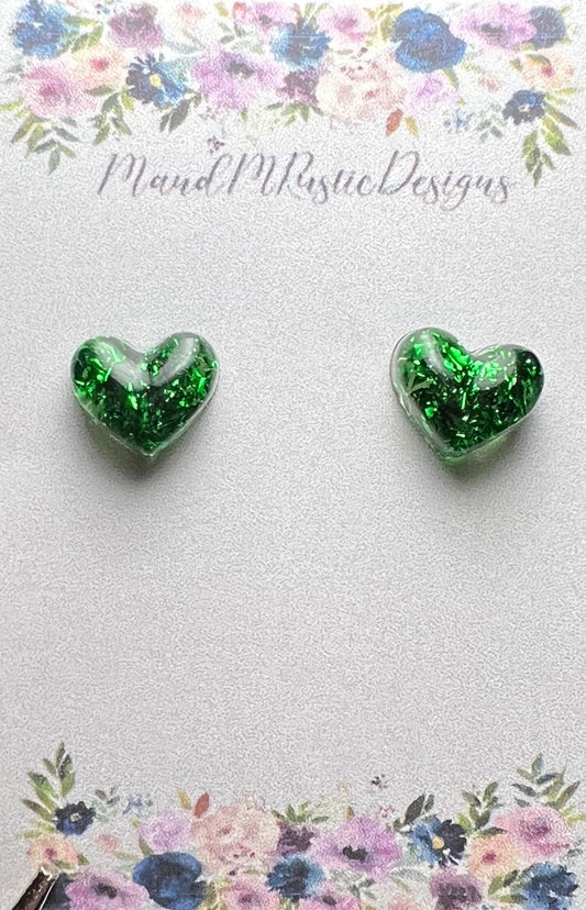 Green glitter resin heart shaped studs pierced earrings. Perfect for St. patrick’s Day!!